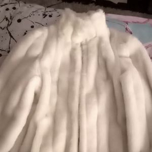 Jessica Simpson fur coat